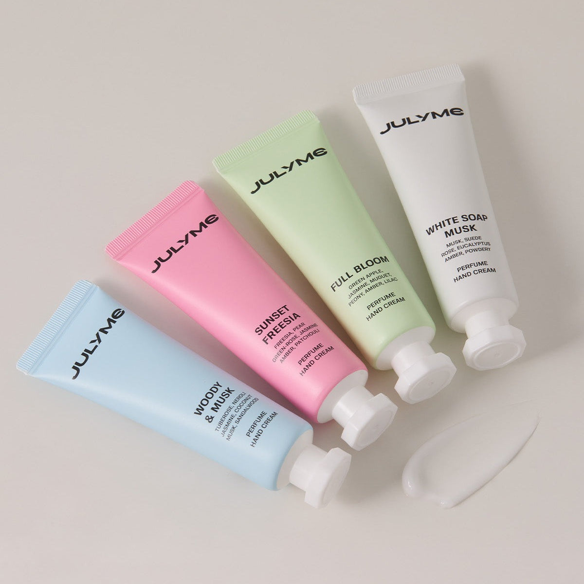 JULYME Perfume Shea Butter Hand Cream 30ml and other fragrance hand creams in colorful tubes displayed on a surface.