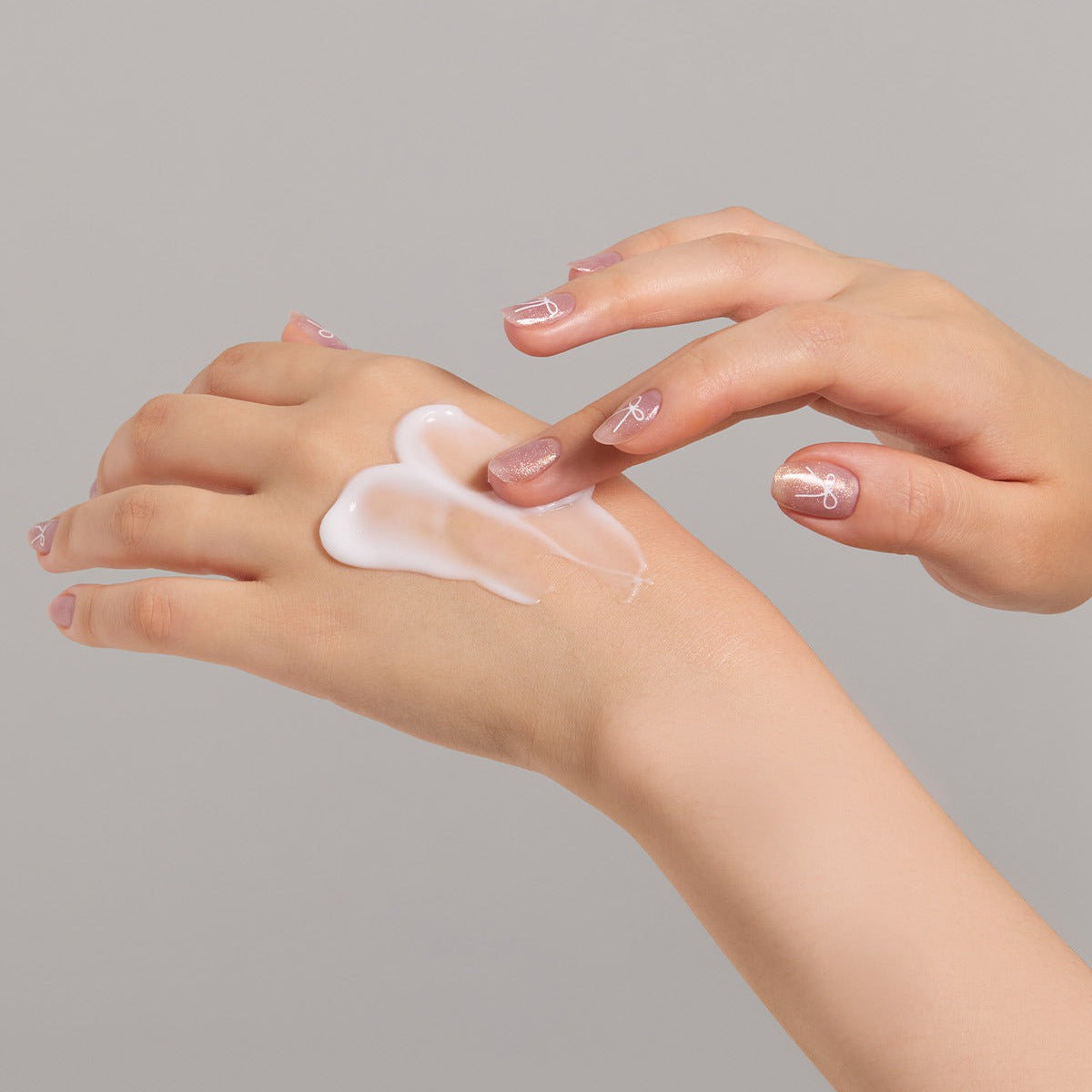 Applying JULYME Perfume Shea Butter Hand Cream 30ml on hands for smooth and moisturized skin