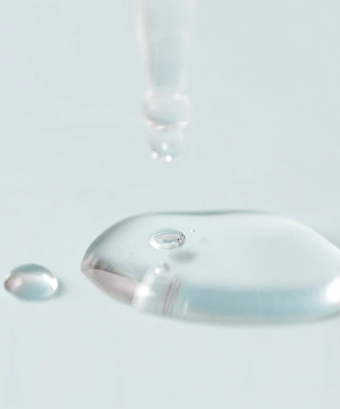Close-up of JUMISO D-Panthenol Barrier Soothing Serum 70ml texture with liquid dropper, showcasing its hydrating formula.