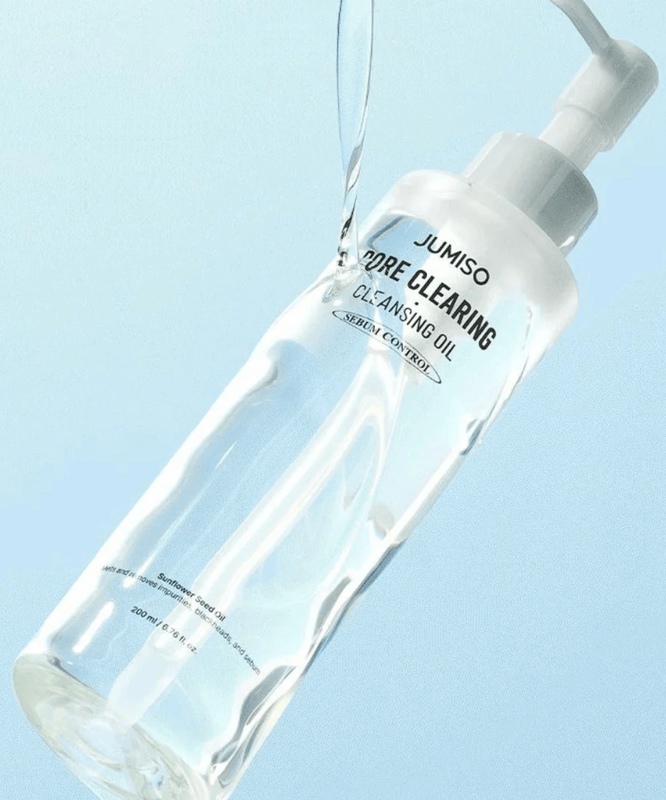 JUMISO Pore Clearing Cleansing Oil 200ml bottle with pump dispenser on a light blue background.