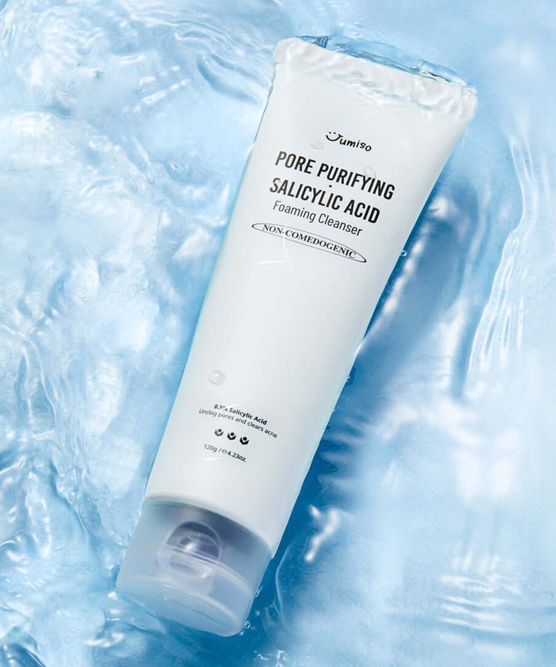 JUMISO Pore Purifiying Salicylic Acid Foaming Cleanser on a textured blue background