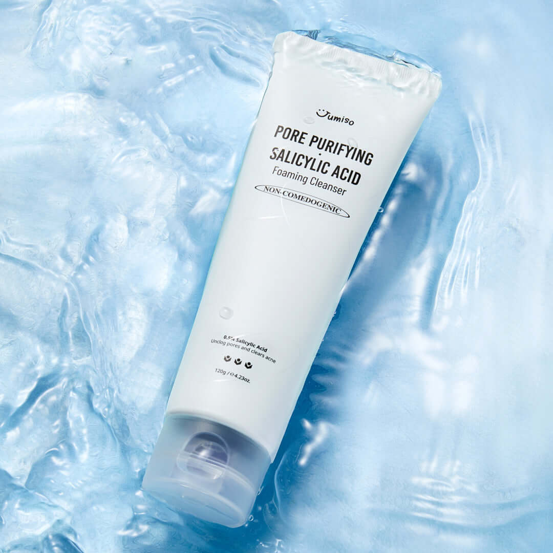 JUMISO Pore Purifiying Salicylic Acid Foaming Cleanser on a textured blue background