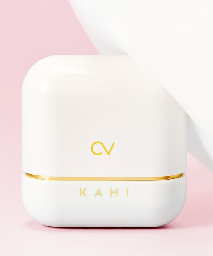 KAHI CV Shine Fit Sun Stick (13.5g) product packaging on a pink background
