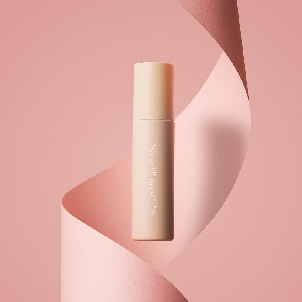 KAHI One Layer Tone-up Body Miist 100ml product bottle on a pink abstract background