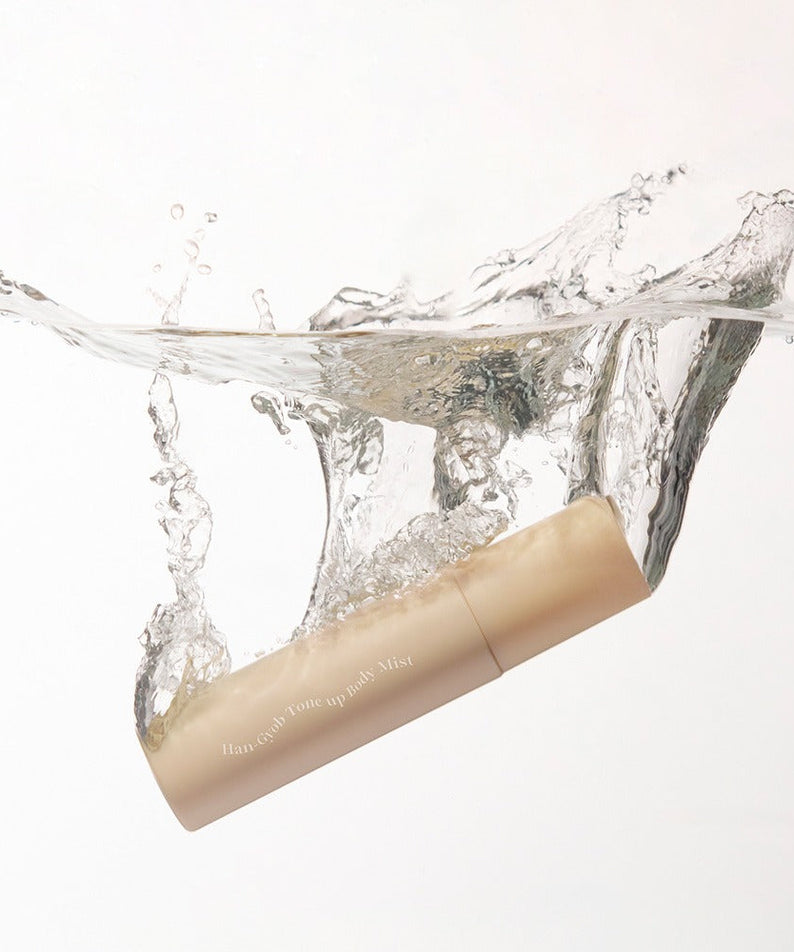 KAHI One Layer Tone-up Body Miist 100ml bottle splashing into clear water