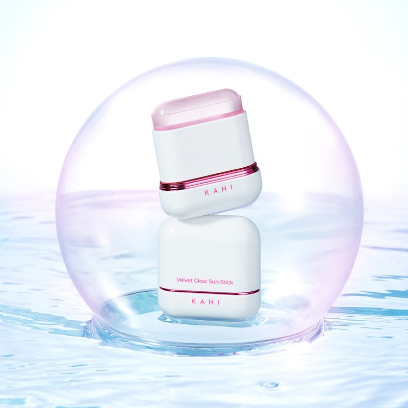 KAHI Velvet Glow Sun Stick 13.5g in a stylish protective case with a reflective surface, highlighting its premium design and quality.
