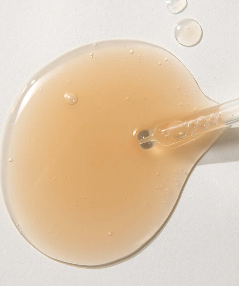 KAINE Kombu Barrier Ampoule serum texture with dropper, showcasing rich formulation for skincare benefits.