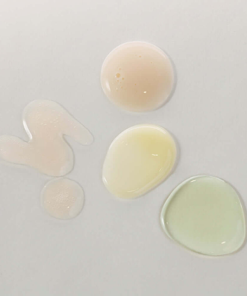 Texture swatches of KAINE Serum Discovery Kit on white background.