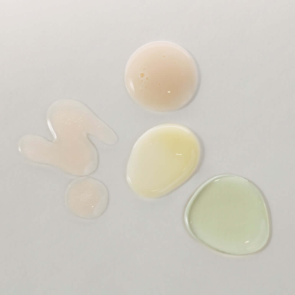 Texture swatches of KAINE Serum Discovery Kit on white background.