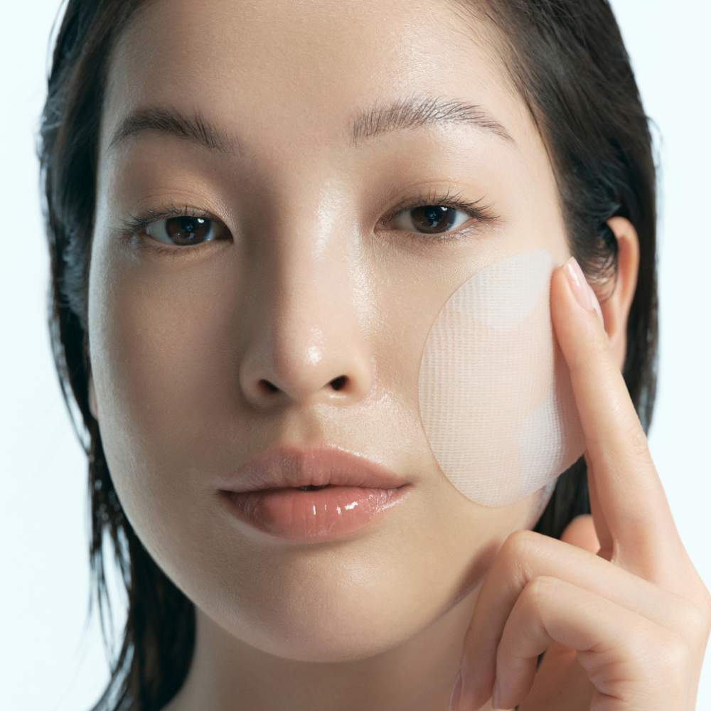 KLAIRS EGF Blue Calming Toner Pads 60 Pads being applied on face for skin soothing and hydration