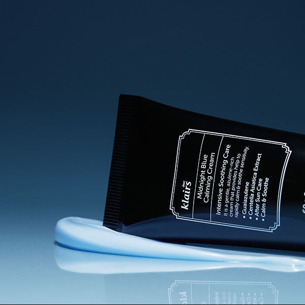 KLAIRS EGF Midnight Blue Calming Cream 60g tube with cream swatch on reflective surface.