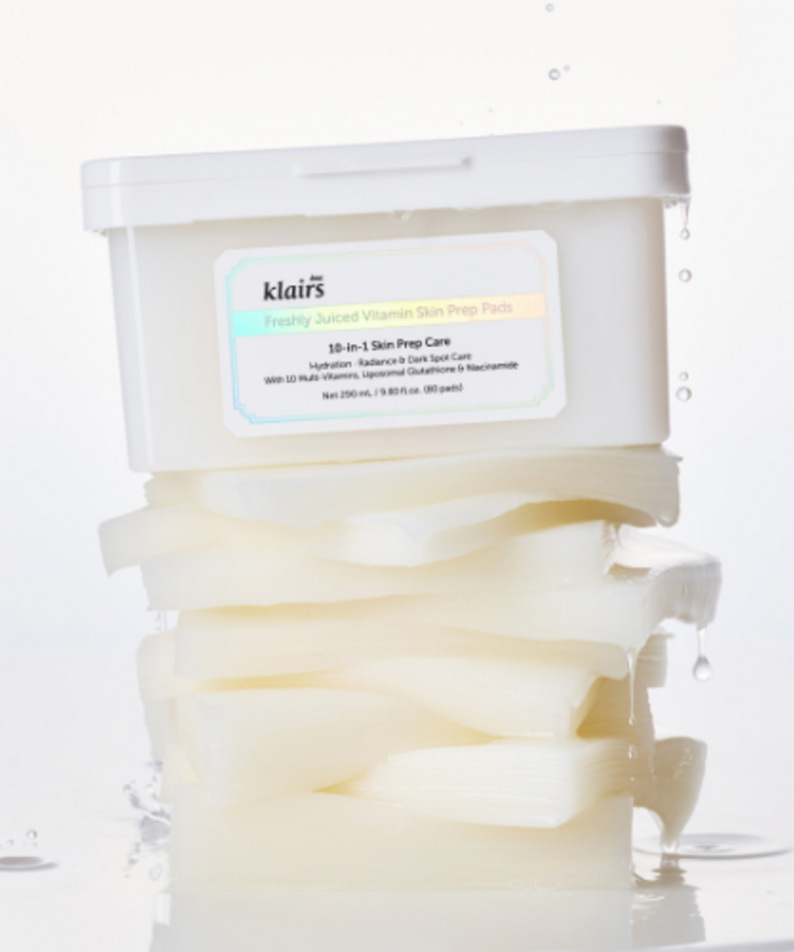 KLAIRS Freshly Juiced Vitamin Hwajalmeok Pad 80 sheets displayed with stacked, moist skincare pads on a white background.