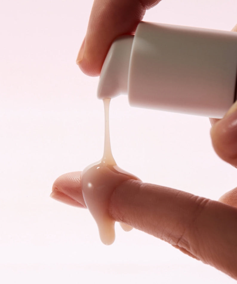 KLAIRS Maple Energy Infusing Serum 30ml being dispensed onto fingers, showcasing texture and application.