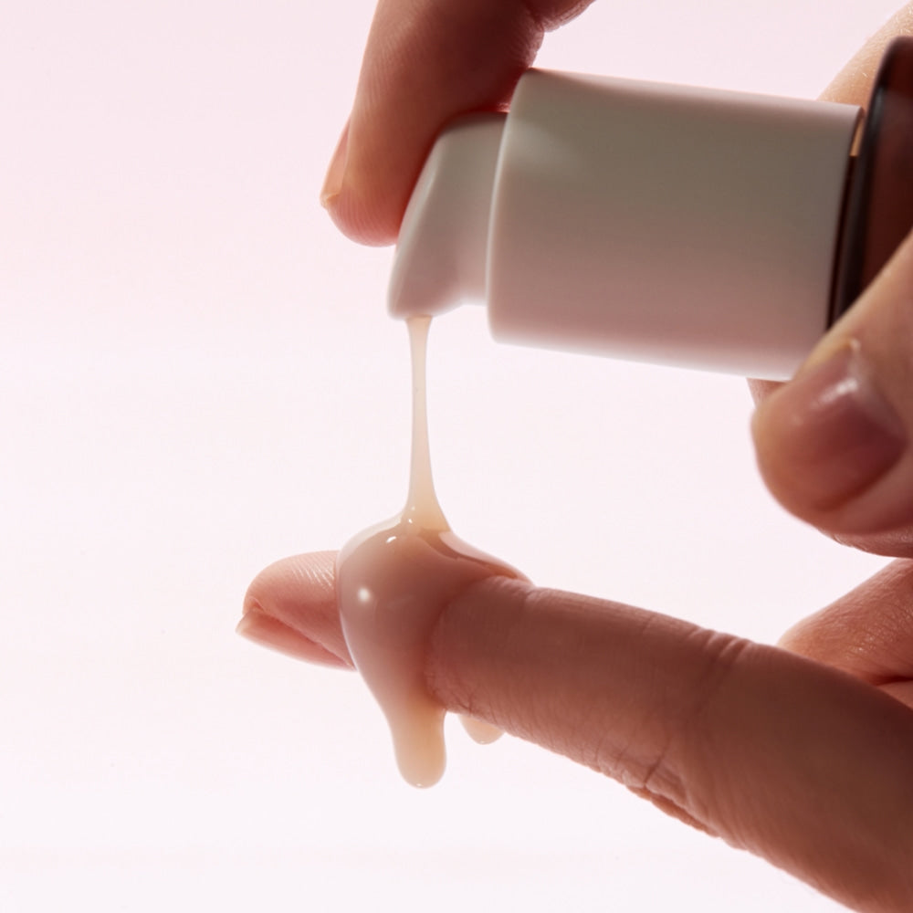 KLAIRS Maple Energy Infusing Serum 30ml being dispensed onto fingers, showcasing texture and application.