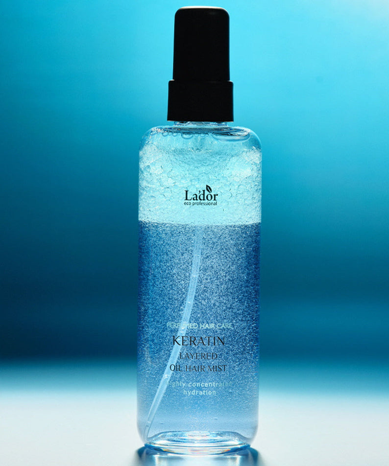 LADOR Keratin Perfume Hair Mist 130ml product image against a blue background.