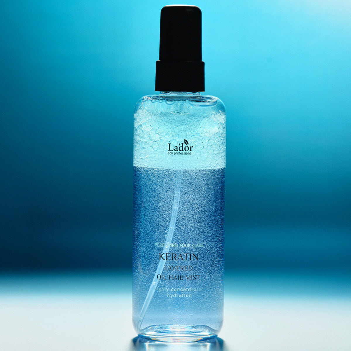 LADOR Keratin Perfume Hair Mist 130ml product image against a blue background.