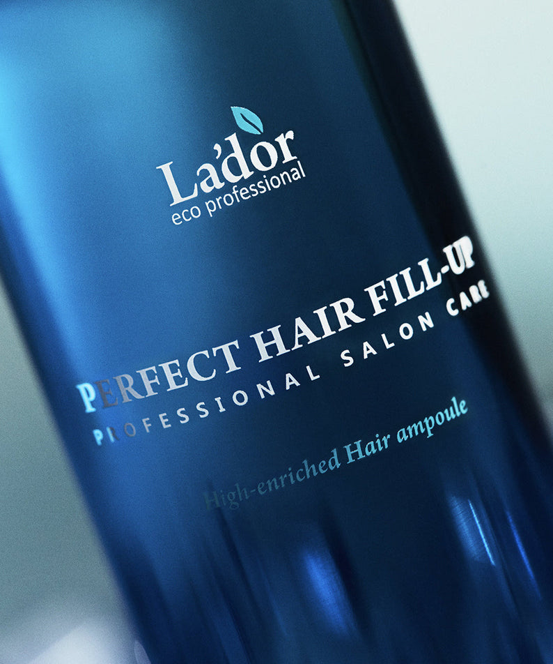 Close-up of LADOR Perfect Hair Fill-Up 150ml bottle, showing label and branding.