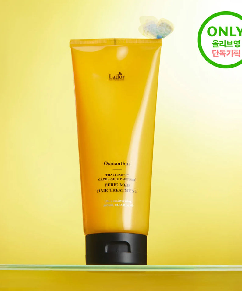 LADOR Perfume Hair Treatment 380ml bottle on a display with yellow packaging and product branding.