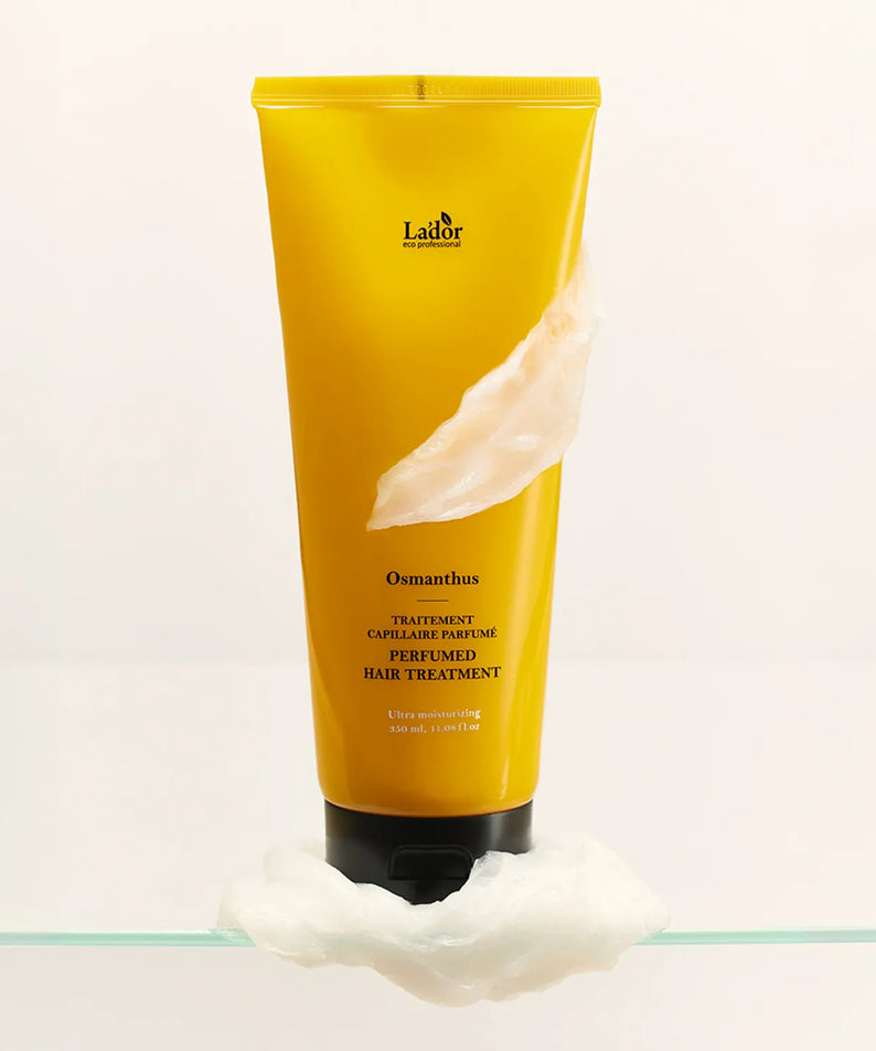 LADOR Perfume Hair Treatment 380ml bottle with creamy texture on a white background, showcasing luxurious hair care product