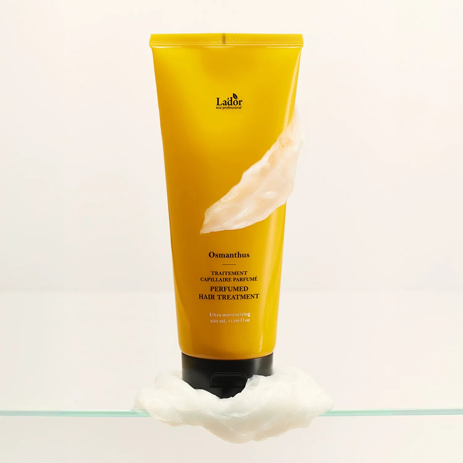 LADOR Perfume Hair Treatment 380ml bottle with creamy texture on a white background, showcasing luxurious hair care product