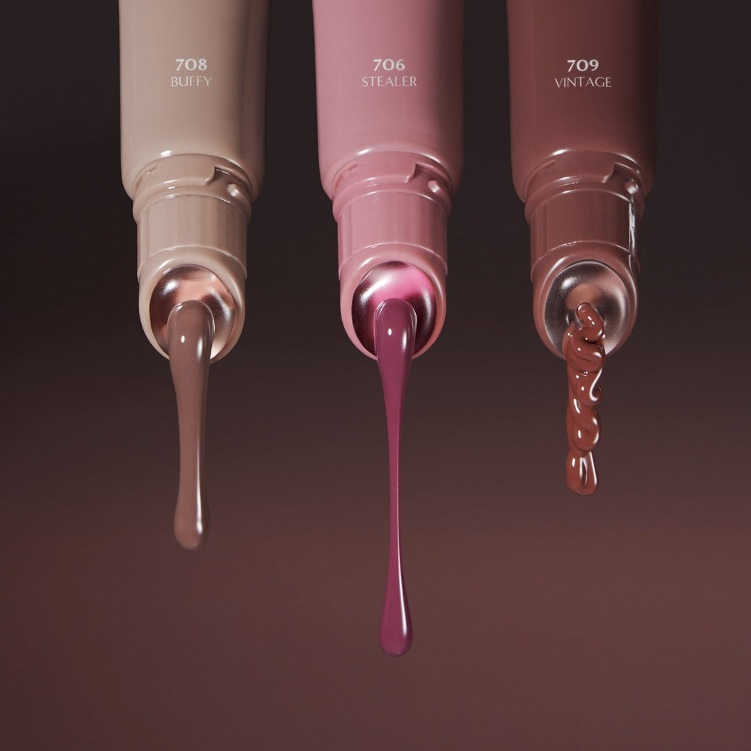 Three tubes of LAKA Fruity Lip Glossionner in shades Buffy 708, Stealer 706, and Vintage 709 with dripping lip gloss.