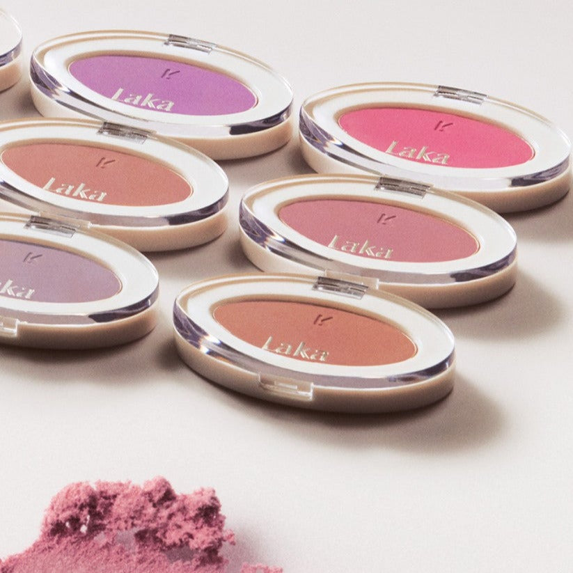 Various shades of LAKA Love Silk Blush compacts on display, vibrant and soft tones perfect for a silky makeup finish.
