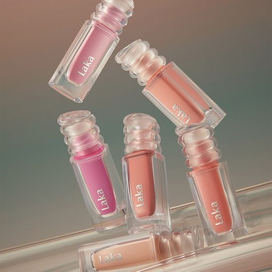 Assorted bottles of LAKA Maxi Glayer Tint showcasing various shades.