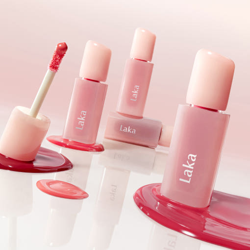 Stylish bottles of LAKA Popping Ballon Tint with open applicator showing vibrant tint color.