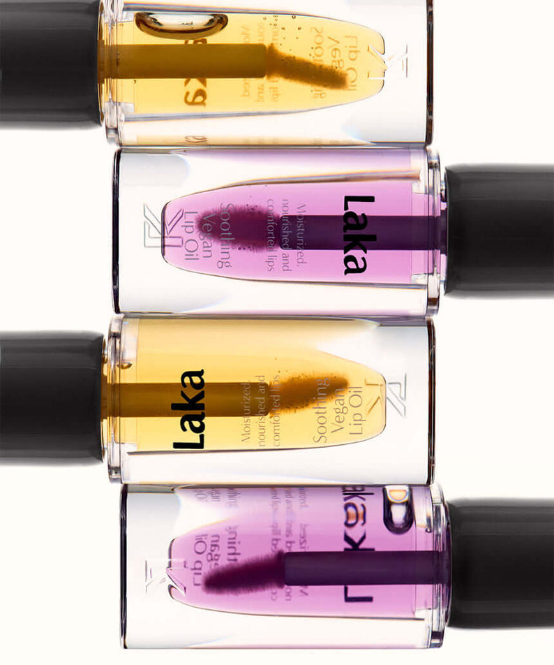 Close-up of LAKA Soothing Vegan Lip Oil bottles in assorted colors.