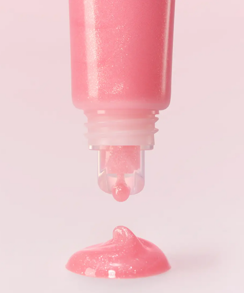 LANEIGE Lip Glowy Balm (Milky Way/Pink Supernova) 10g showing a close-up of the pink balm being dispensed from the tube.