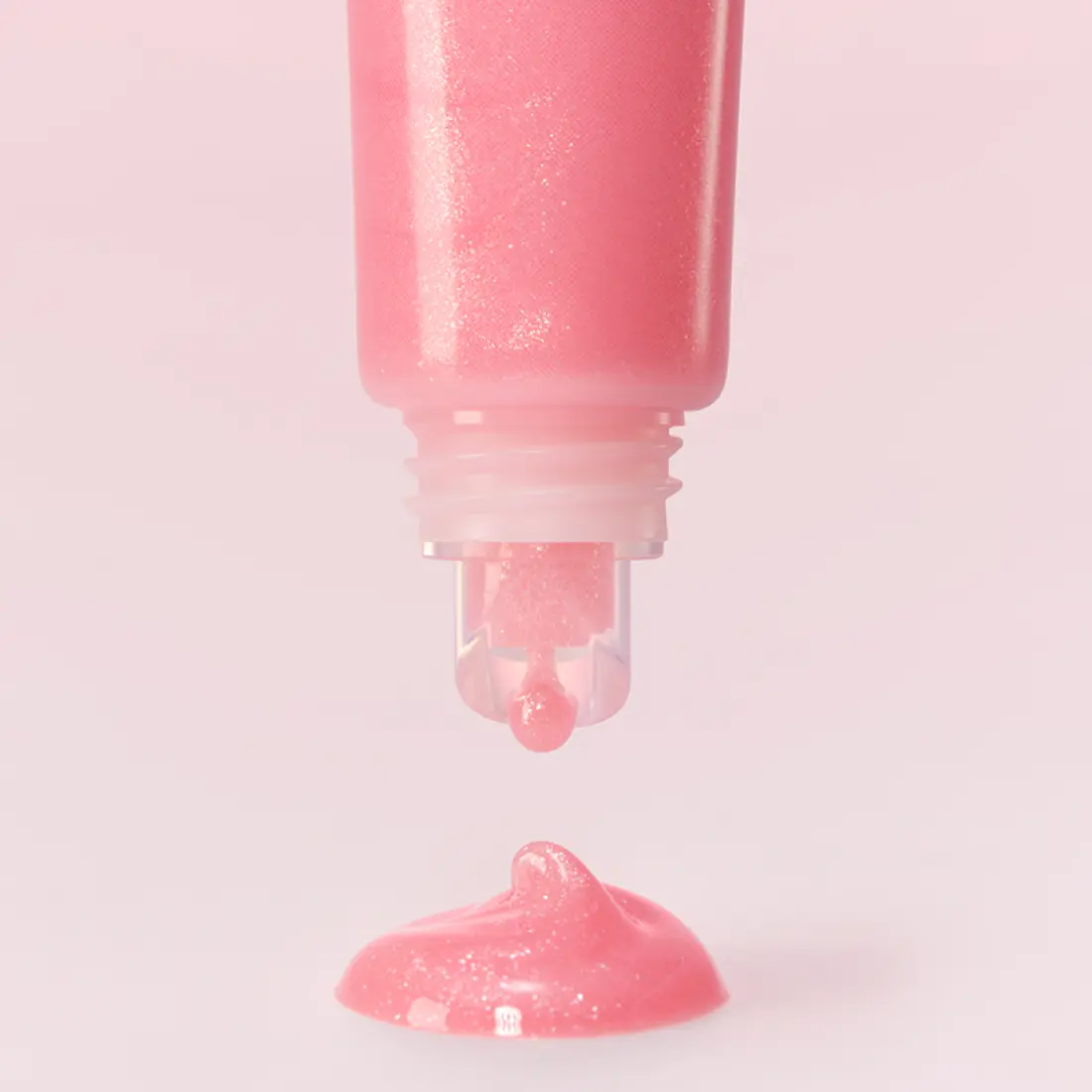 LANEIGE Lip Glowy Balm (Milky Way/Pink Supernova) 10g showing a close-up of the pink balm being dispensed from the tube.