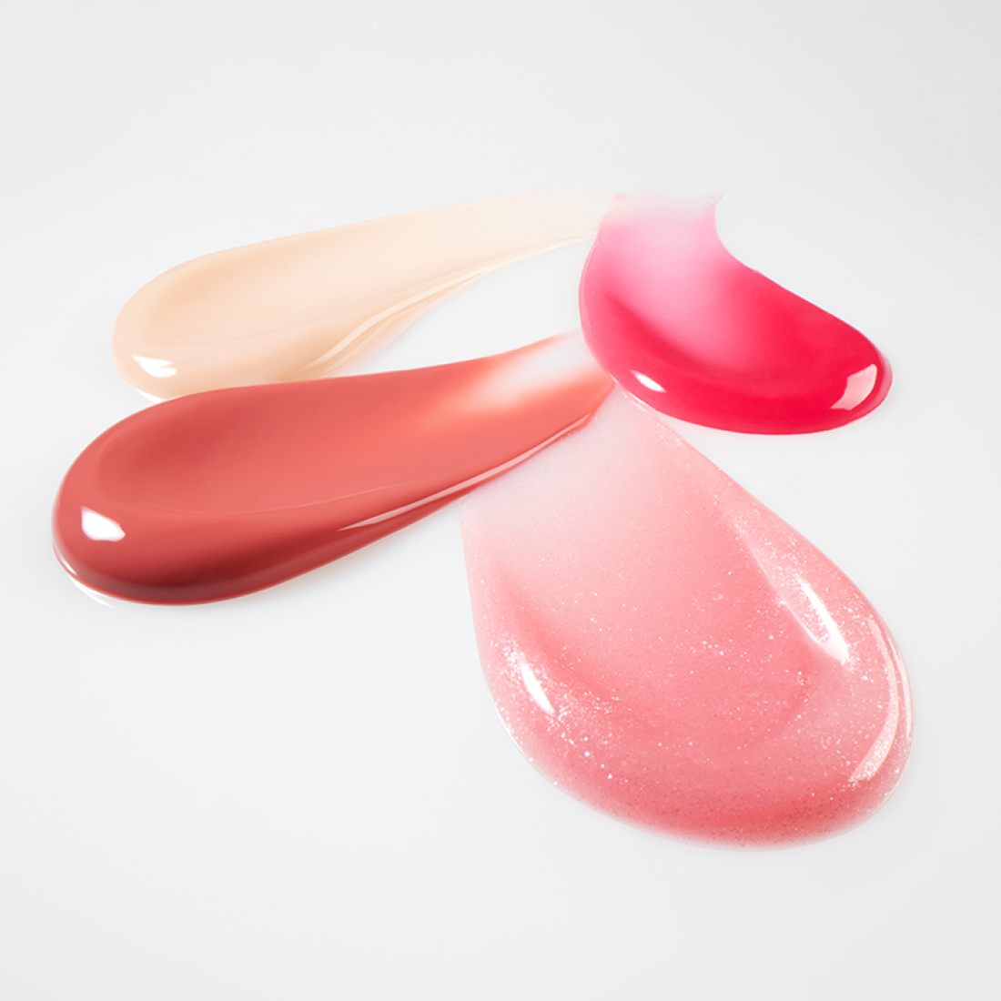 Swatches of LANEIGE Lip Glowy Balm (Milky Way/Pink Supernova) 10g displaying vibrant shades and glossy textures.