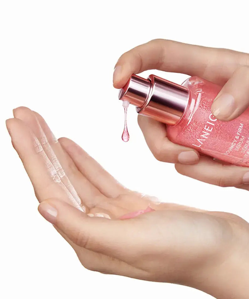 Applying LANEIGE NEW Bouncy & Firm Serum 30ml to hands, showcasing the product's texture and packaging.