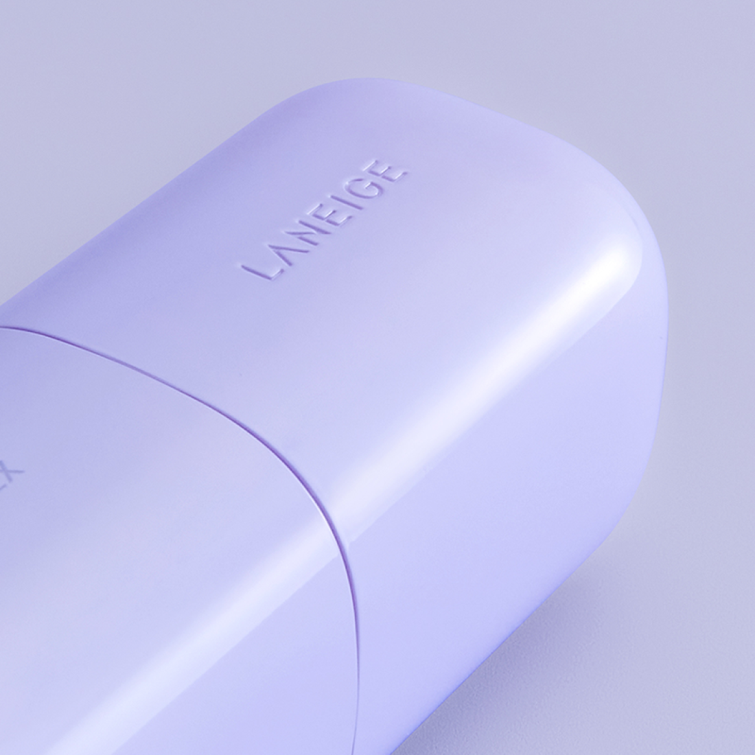 LANEIGE Skin Veil Base SPF28/PA++ 30ml bottle in light lavender, close-up view showcasing sleek design and branding.