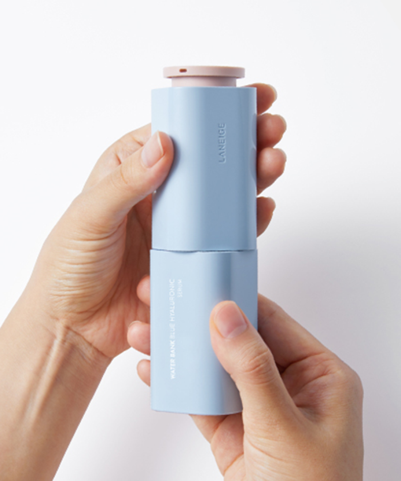 Hands holding LANEIGE Water Bank Blue Hyaluronic Serum 50ml bottle