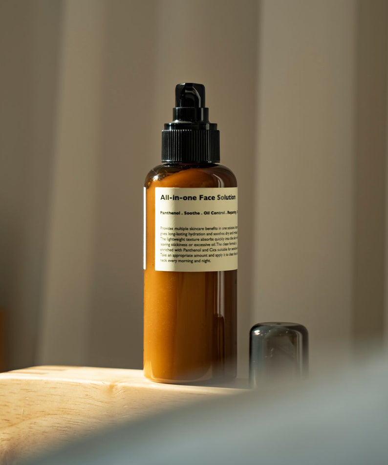 LAZY SOCIETY All-in-One Face Solution 150g brown pump bottle on wooden surface Gentleman Korea Korean men skincare export