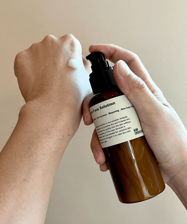Gentleman Korea product shot: LAZY SOCIETY All-in-One Face Solution 150g pump dispensing cream on male hand for Korean men’s skincare