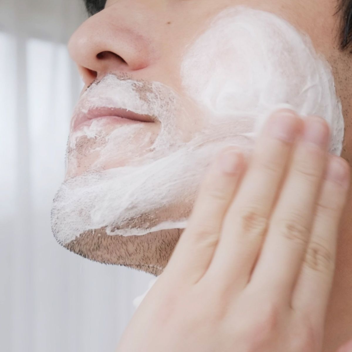 LAZY SOCIETY Superme Shaving Cream 100ml lathering on a gentleman’s face applied by hand — Korean men’s grooming by Gentleman Korea