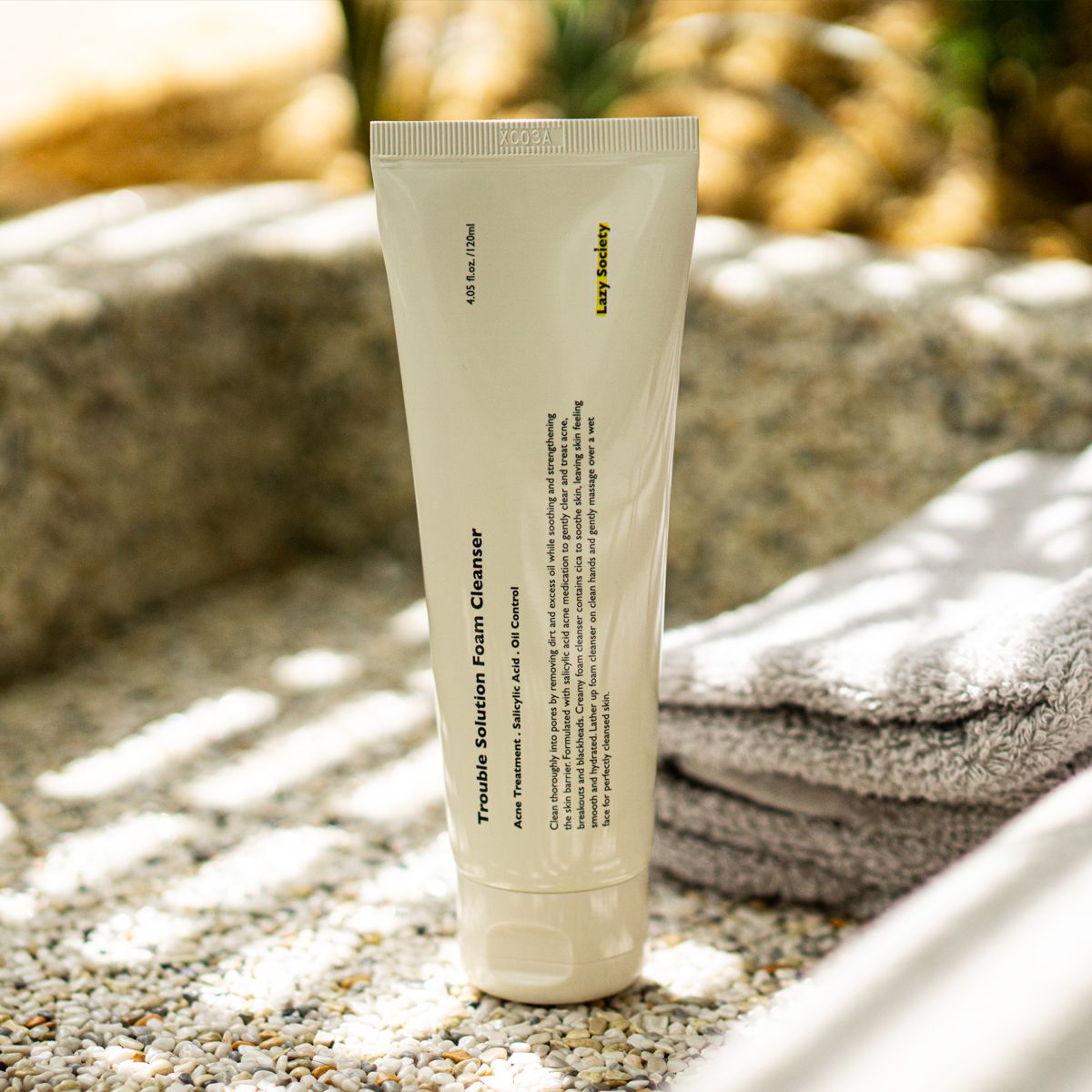 Gentleman Korea product shot of LAZY SOCIETY Trouble Solution Foam Cleanser 120ml tube on towel for men’s Korean skincare