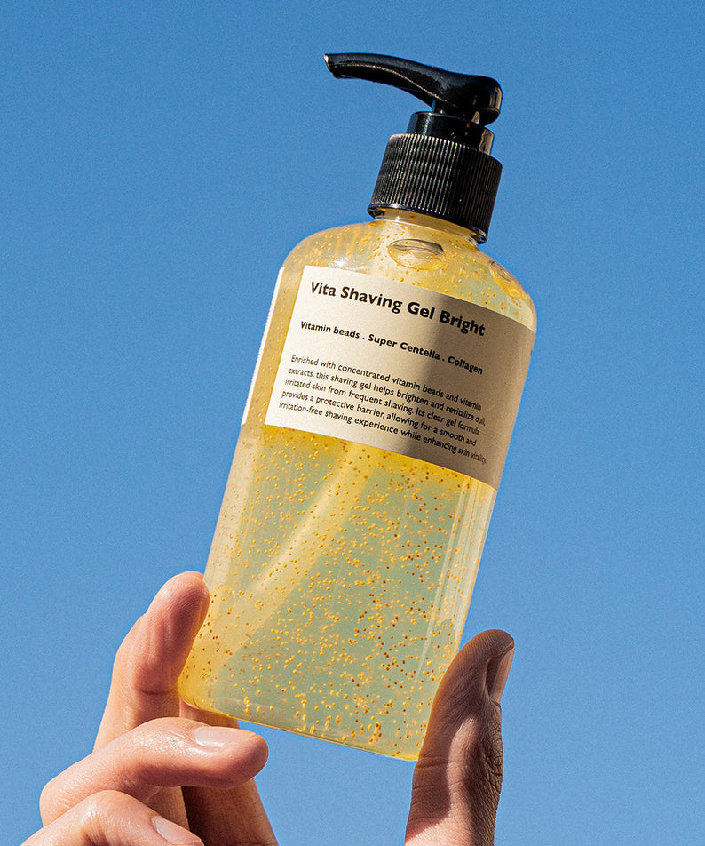 LAZY SOCIETY Vita Shaving Gel Bright 250ml held by hand against blue sky — Gentleman Korea men’s brightening shaving gel