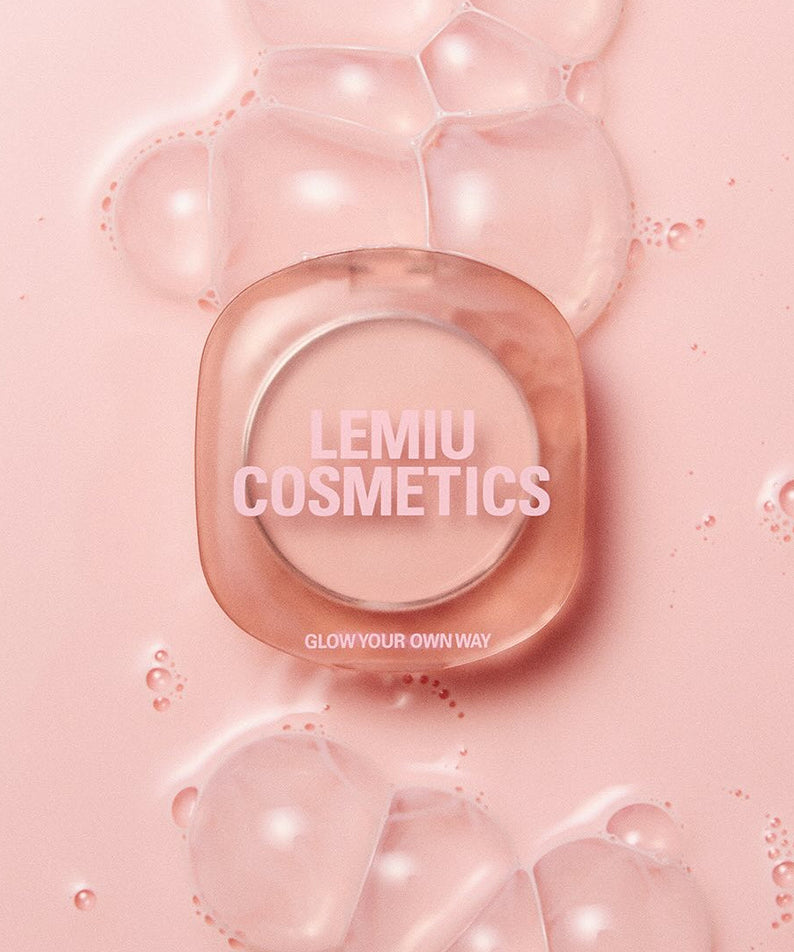 LEMIU Eye To Cheek compact on pink background with bubbles, LEMIU COSMETICS branding visible, promoting product versatility.