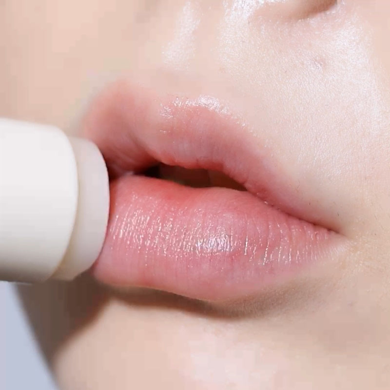 Application of LEMIU Sole Mood Vegan Lip Balm on lips for hydration and vegan beauty.