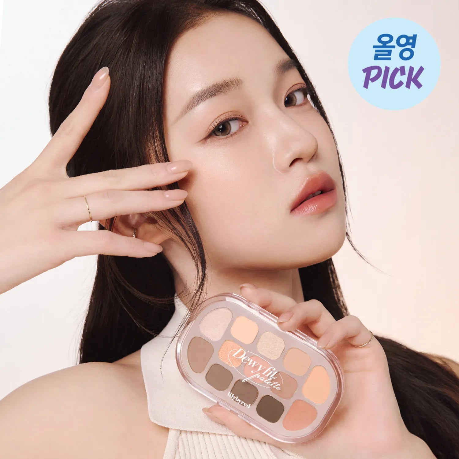 Woman holding LILYBYRED Dewy Fit Palette showcasing makeup shades