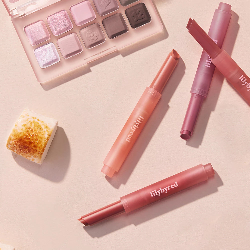 LILYBYRED Milky Blur Fondue Bar with makeup palette and beauty products in soft pink shades.