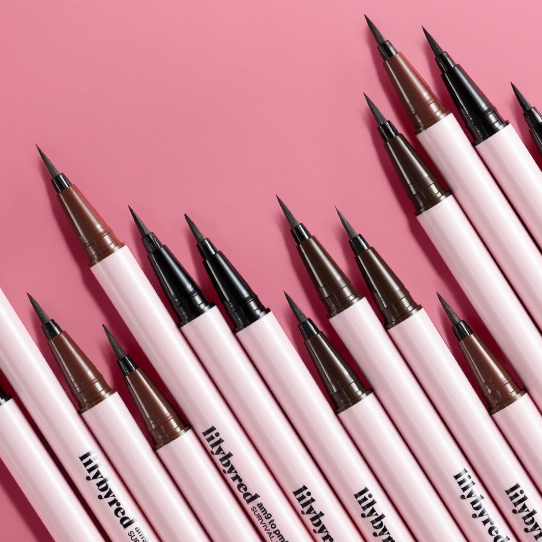 LILYBYRED am9 to pm9 Survival Penliner arranged on a pink background, showcasing precision tips in black and brown shades.
