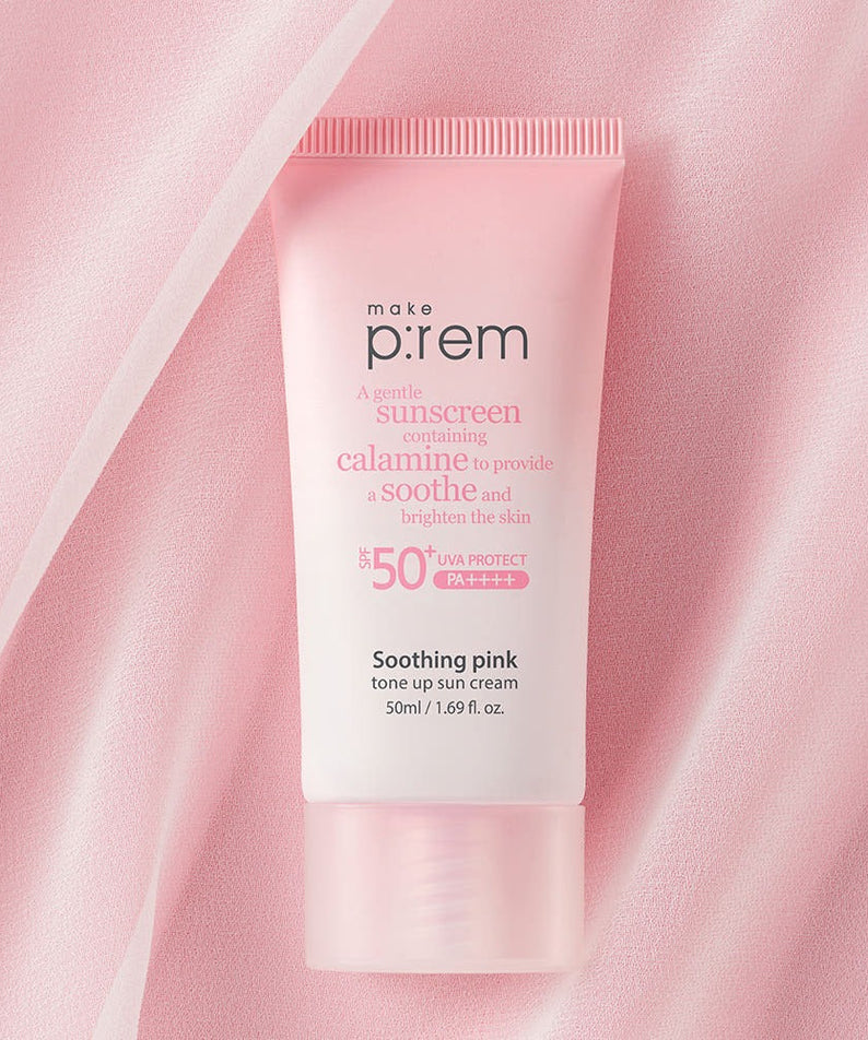MAKE P:REM Soothing Pink Tone-Up Sunscreen SPF 50+ PA++++ 50ml pink tube on fabric background