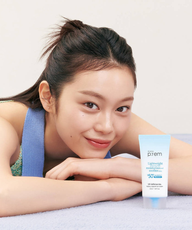 Woman with MAKE P:REM UV Defense Me Watery Capsule Sunscreen 50ml SPF50+ PA++++ smiling beside the product tube.