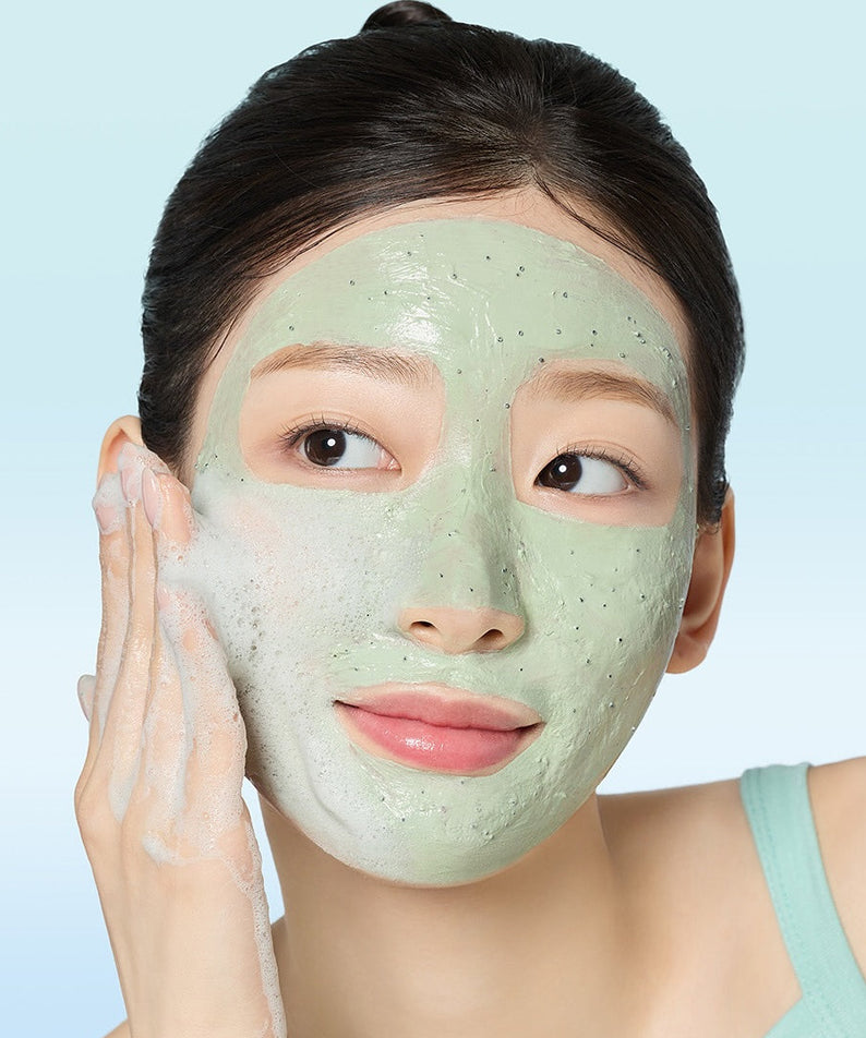 Woman using MAMONDE Amazing Deep Mint Chocolate Pack Cleanser 135g on face, showcasing smooth and glowing skin care results.
