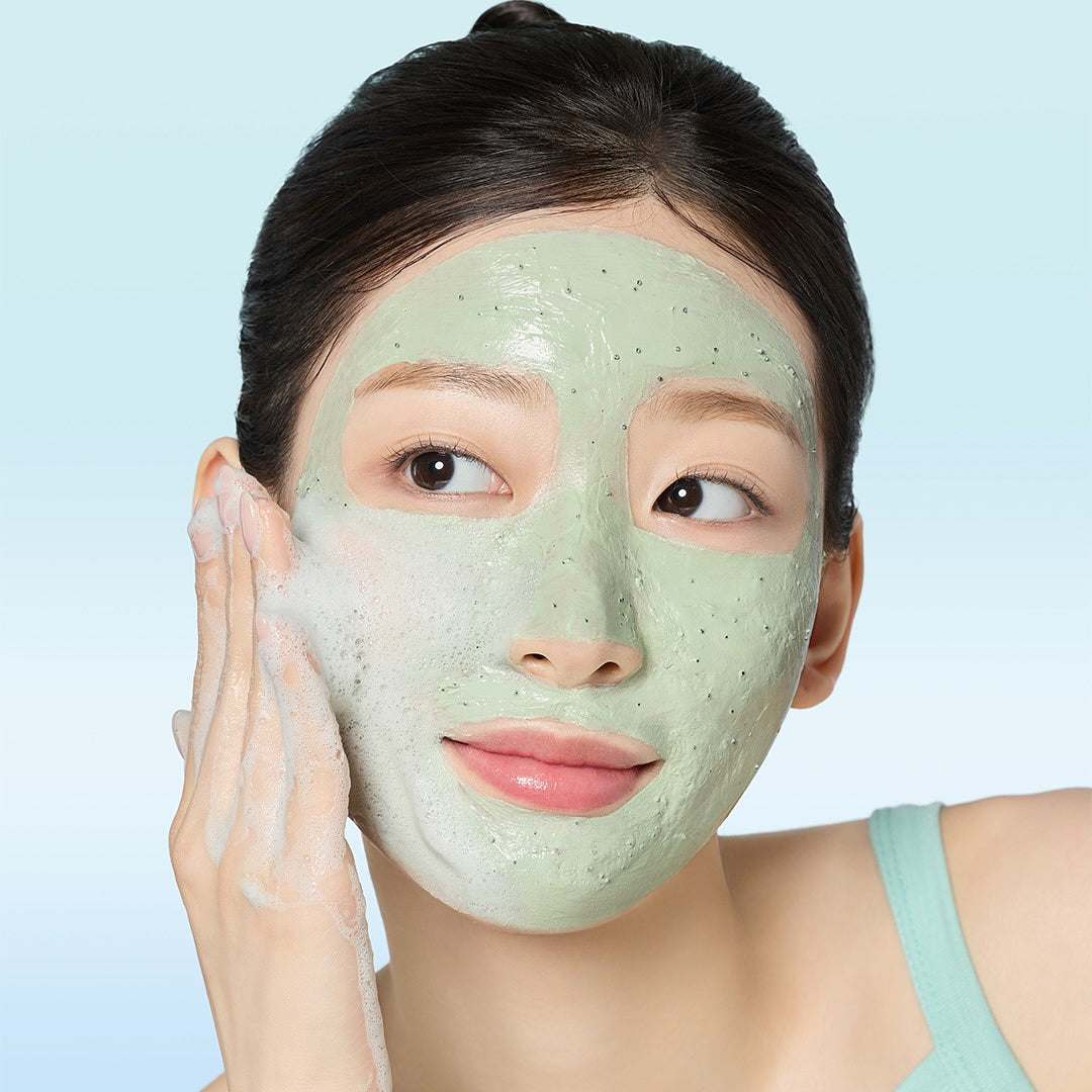 Woman using MAMONDE Amazing Deep Mint Chocolate Pack Cleanser 135g on face, showcasing smooth and glowing skin care results.