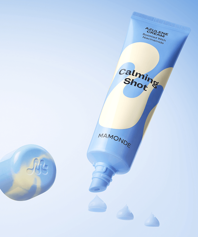 MAMONDE Calming Shot Azulene Cream 60ml tube with cream swatches on a blue background